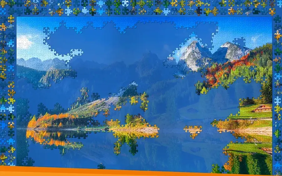 Puzzle di Jigsaw World con un paesaggio di montagna in fase di composizione